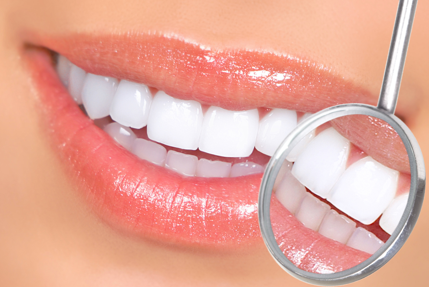 Healthy woman teeth and a dentist mouth mirror
