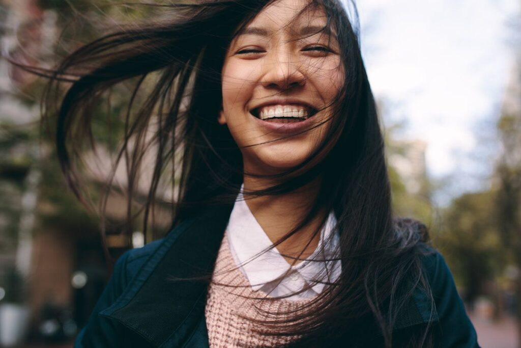 Close up of a smiling asian woman